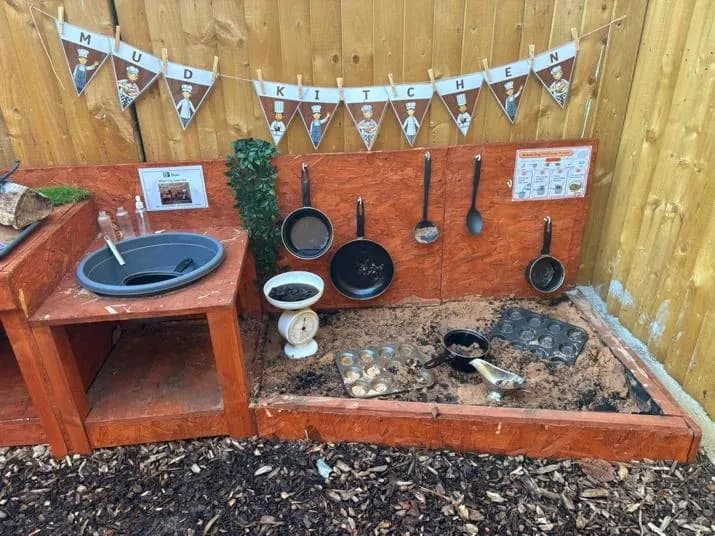 bloom childcare outdoor mud kitchen play area setup
